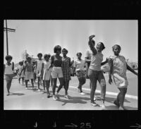 African American girls walk to summer jobs in Watts, Los Angeles (Calif.)