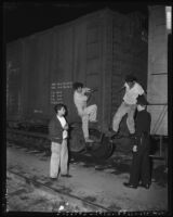 Undocumented Mexican workers arrested in rail yard, Los Angeles, 1953