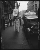 Demonstrator protests illegal raids by the Immigration Department, Los Angeles, 1940s