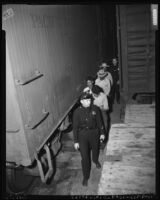 Undocumented Mexican workers arrested in rail yard, Los Angeles, 1953