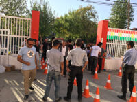 Security guards checking people entering the stadium