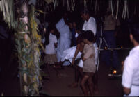 Sarpam Thullal Pulluvan Serpent Ritual - Nazir Ali Jairazbhoy stands with tripod during pause in the ritual, Peramangalam (India), 1984