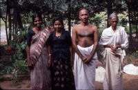Sreedharan Nair and three women in coconut grove, Kerala (India), 1984