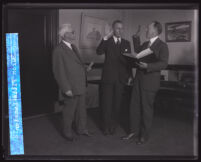 Clerk L. E. Lampton administers the oath of office to the new district attorney Buron Fitts, Los Angeles, 1928