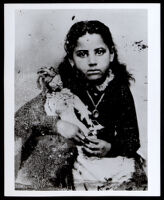 Girl, possibly Anna Dugged Owens, holding a doll, circa 1880-1890