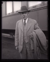 Admiral William V. Pratt arrives at train station, Los Angeles, 1931