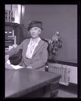 Attorney Elizabeth Kenney sitting at her desk, Los Angeles, 1920-1939