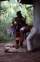 Ottan Thullal - a dresser adjusts the costume of dancer B. C. Balachandar, for his performance of Kalyana Sougandhikam, Ayamkudy (India), 1984
