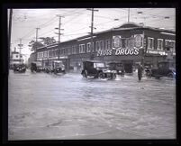 Flooded commercial intersection after heavy rain, Los Angeles, 1926