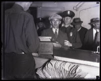 Fred Reynolds is arrested along with eleven others in violation of the Volstead Act, Los Angeles, 1931