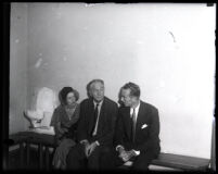Nancy Clark, W. I. Gilbert, and David H. Clark seated on a bench, Los Angeles, 1931