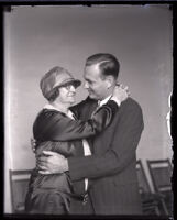 Josephine Kelley and Leo Patrick Kelley embrace each other at the courthouse during the Leo Patrick Kelley murder case, Los Angeles, 1928