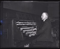 Arthur Blakeley playing an organ, Los Angeles, circa 1920s