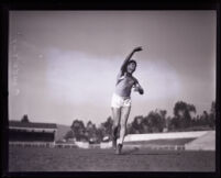 Vic Conde, Occidental College athlete mid throw, Los Angeles, 1925-1927