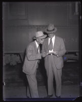 Ben Kendall and mayor Fletcher Bowron at a train station, Los Angeles, circa 1939