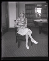 Eunice Pringle sits on a chair in an office during Alexander Pantages rape trial, Los Angeles, 1929