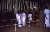 Sarpam Thullal Pulluvan Serpent Ritual - women and children stand in line to enter, Peramangalam (India), 1984