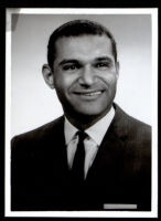 Billy Mills in a suit with pocket square, 1950-1960