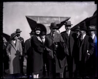 Actress Anna Q. Nilsson with explorer Roald Amundsen amongst a small crowd at Union Station, Los Angeles, 1926