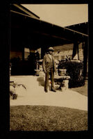 Man standing in front of a house, 1920-1940