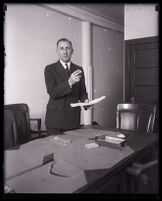 Buron Fitts in an office, Los Angeles 1920s