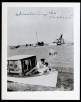 Dr. Thomas Nelson christening his motorboat, 1907