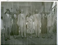 Dr. John A. Somerville and three couples standing in a yard, 1950s