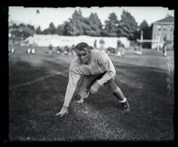 Fay Scow Thomas in a football pose at the field at USC, Los Angeles, circa 1925