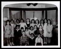 Group portrait of 19 children, probably including Patricia Roberts, 1940s