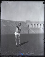 Milton Angier throws a javelin at the Memorial Coliseum, Los Angeles, 1924