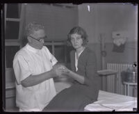 Nurse Owen Reddy assists murder suspect Winnie Ruth Judd before hand surgery, Los Angeles, 1931