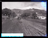 Muddy street after flooding caused by heavy rains, Burbank, 1928