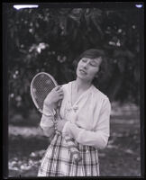 Madame Simone Puget holding a tennis racket, Coronado, 1918