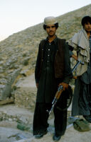 Young Mujahid Stands With Their Gun