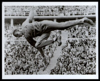 Cornelius Cooper Johnson executing a high jump at the Olympic stadium, Berlin, 1936