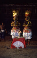 Theyyam festival - Thirayāṭṭam performance with two dancing aṅkakkāran (fighter) characters, Kalliasseri (India), 1984