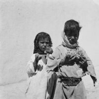 Bedouin children eating fruits