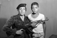 Studio portrait of a Palestinian resistance fighter with her brother