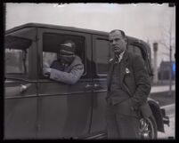 Stunt driver Hayward Thompson in his Pontiac Six beside his manager W. H. Watson, Los Angeles, 1927 