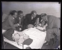 Winnie Ruth Judd, murder suspect, with husband Dr. W. C. Judd and reporters at the Georgia Street Receiving Hospital, Los Angeles, 1931 