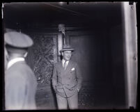 Man standing outside of a building at the time of the Asa Keyes trial, Los Angeles, 1929