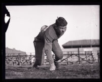 Football player Phil Kerr in a football pose, Los Angeles, 1924