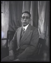 Portrait of J. W. Randolph sitting in a wooden chair, Los Angeles, 1929