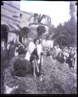 Woman sitting on a grape mound, San Gabriel, 1928