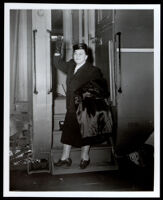 Charlotta Bass boarding a train en route to Washington, D.C., Los Angeles, 1952 (?)