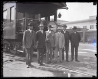 Union Pacific Railroad executives from Los Angeles and Omaha stand in front of a new luxury train car at Central Station, Los Angeles, 1925