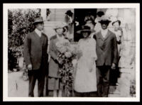 Relatives of Vivian Osborne Marsh standing in front of a house, 1920s