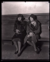 Wife and daughter of Asa Keyes wait to testify at his trial, Los Angeles, 1929