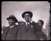 Former district attorney Asa Keyes smokes a cigar upon his arrival back home from prison, Glendale, 1931