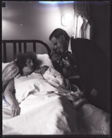 Judge Samuel R. Blake standing over his wife Beatrice B. Blake and their newborn daughter Barbara Blake, Los Angeles, 1927